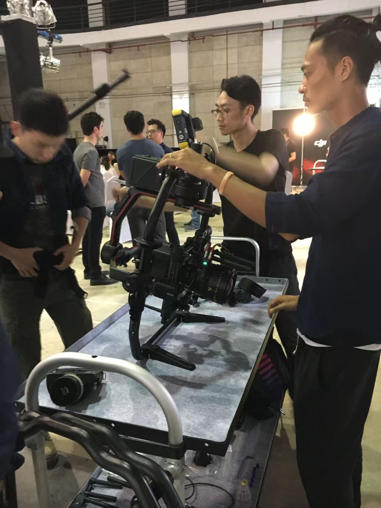 Crew preparing a cinema camera and stabiliser